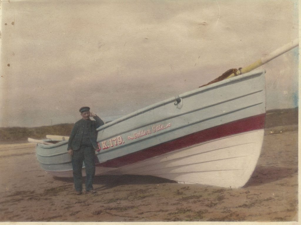 Fisherman John Percy Douglas with his coble, circa 1920