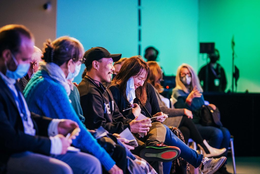 Audience members at the Living-Language-Land event at COP26 enjoy thinking about their own meaningful words.